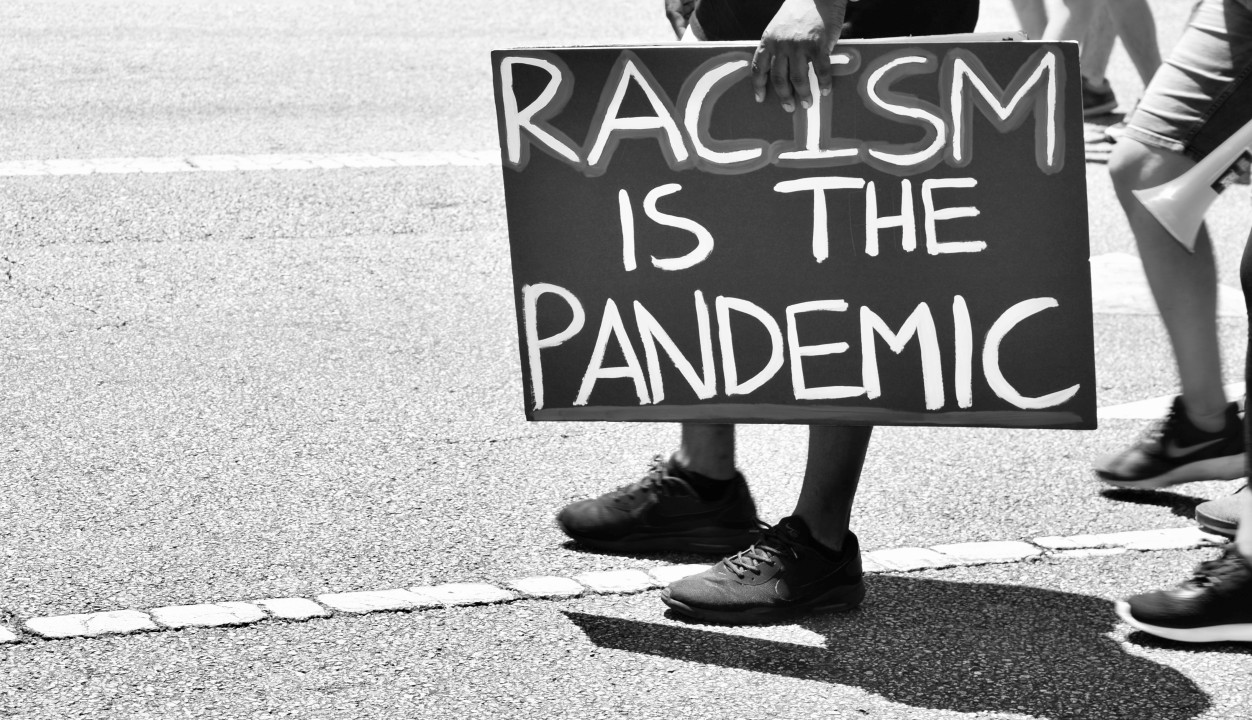 racism poster sign