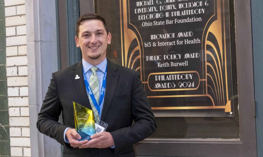 Adam with award