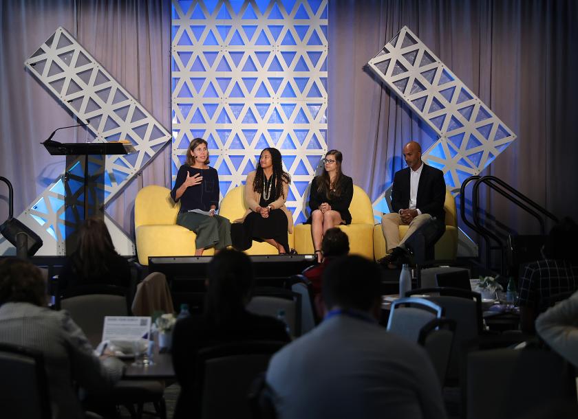panelists sitting on stage