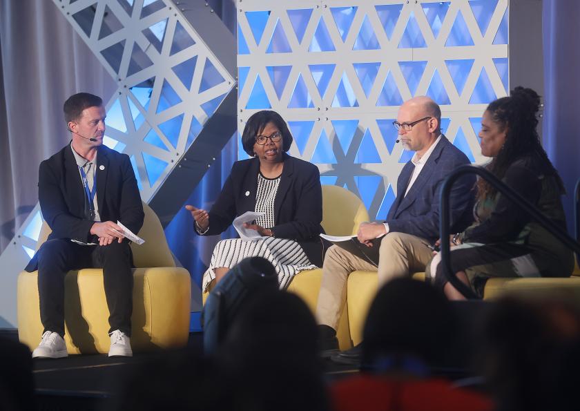 panelist sitting on stage