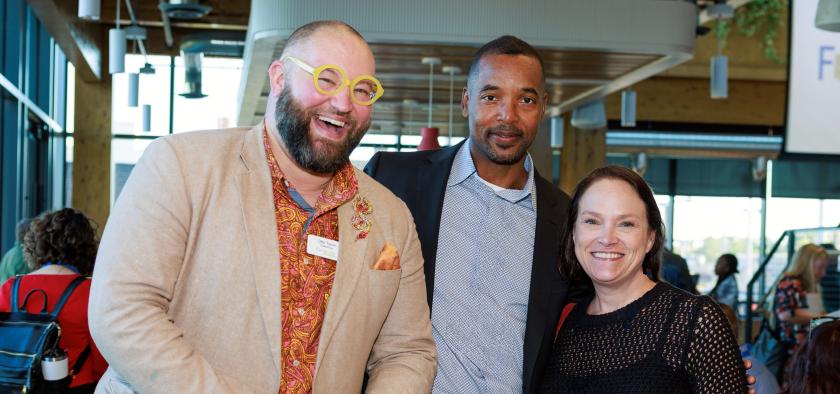 three people standing