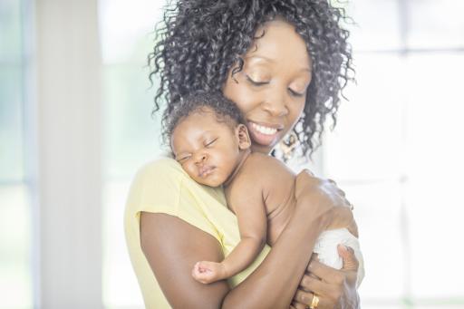 mother holding baby