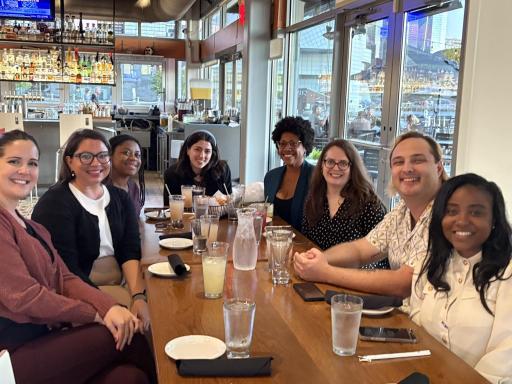 group of people sitting at table