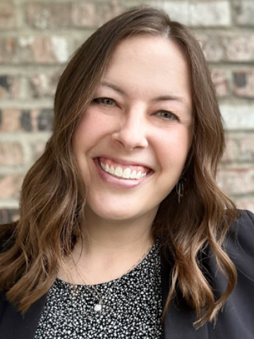 Headshot with brick background